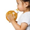 Baby Drinking From Hevea 2-in-1 Glass Baby Bottle With Removable Star Ball
