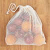 A Slice of Green Large Organic Cotton Net Produce Bag Filled With Fruit With Drawstring Closed