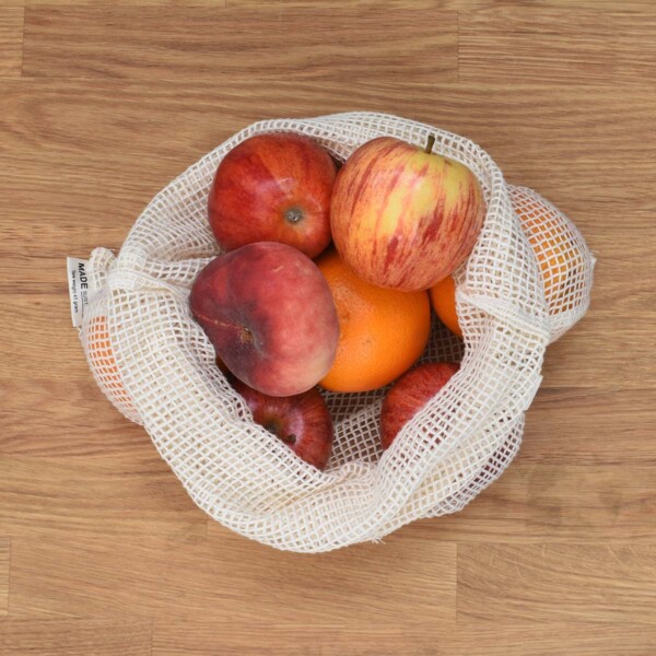 A Slice of Green Large Organic Cotton Net Produce Bag Open and Full of Fruit
