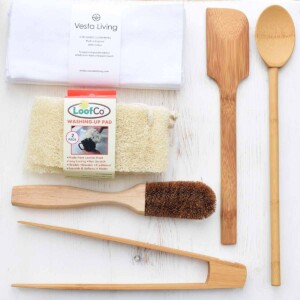Kitchen Essentials with coconut dish brush, washing up pads, unpaper towels and a range of bamboo kitchen utensils