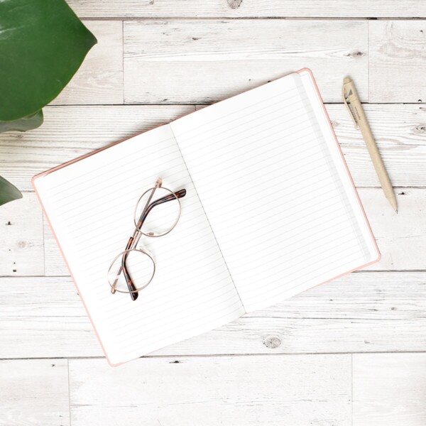 A Good Company Stone Paper Dusty Pink A5 Notebook Open On Desk With Pen And Glasses