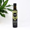 Hunter & Gather Cold Pressed Extra Virgin Avocado Oil pictured next to plant