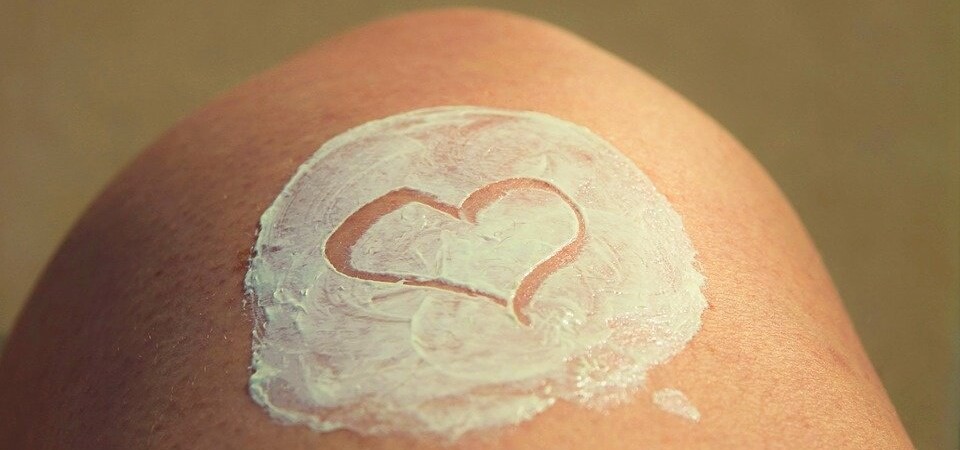 heart shape drawn into sun cream