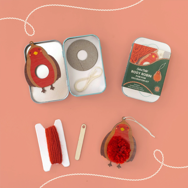 Cotton Twist Rosy Robin pom pom craft kit: one open metal tin, wooden base, rust-coloured yarn, and one ornament.